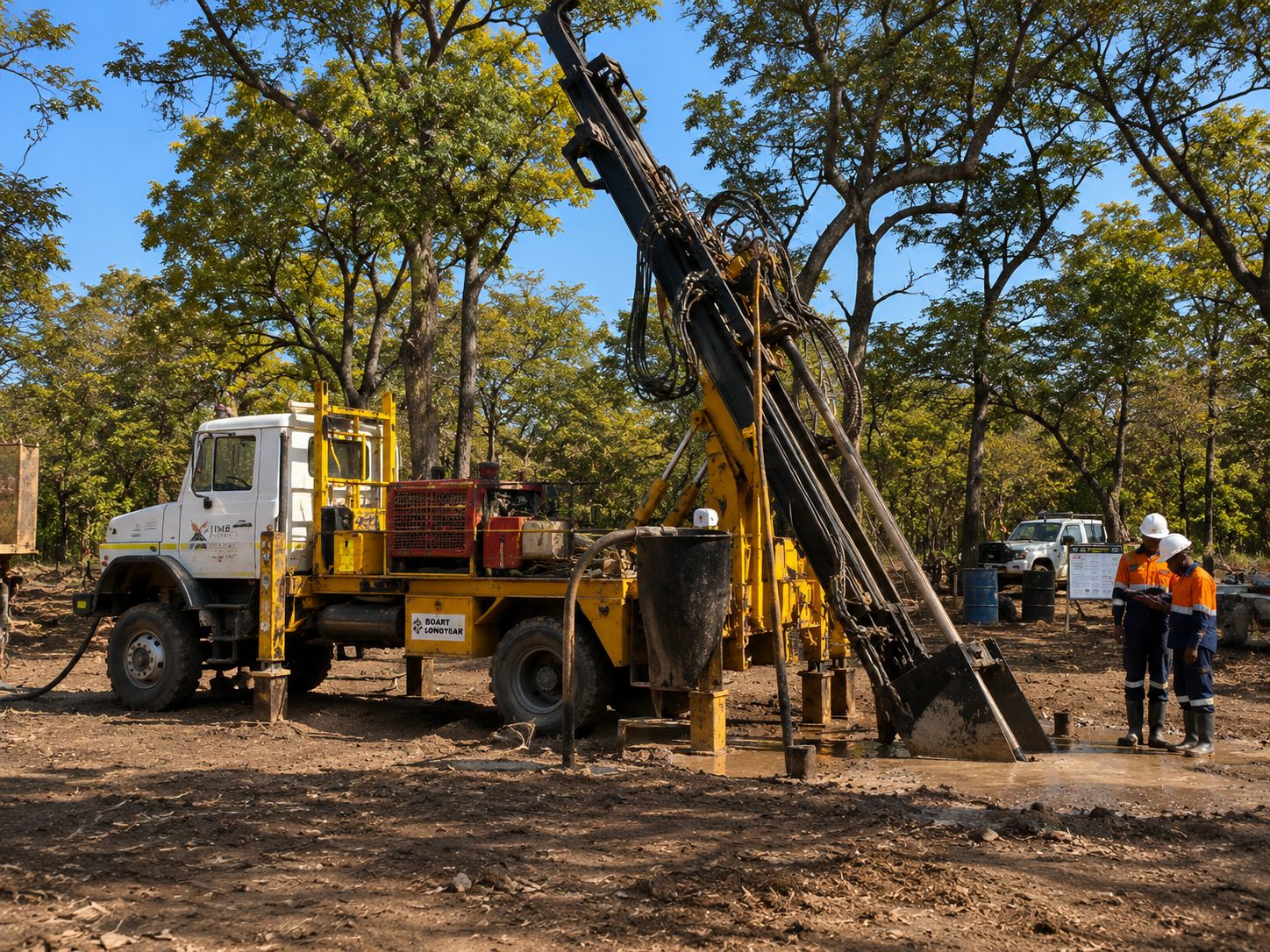 Drill crew handling rods during an exploration programme